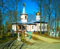 .Wooden Church in the spring with burial crosses Royalty Free Stock Photo