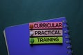 Curricular Practical Training text on sticky notes. Office desk background