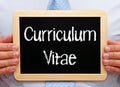 Curriculum Vitae - Manager holding chalkboard with text Royalty Free Stock Photo