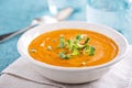 Curried carrot soup with cream and herbs