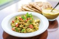 curried cashew dressing over lentil salad, naan bread piece