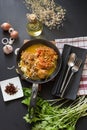 Curried Noodle Soup with spicy coconut milk and beef In a black Royalty Free Stock Photo