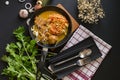 Curried Noodle Soup with spicy coconut milk and beef In a black Royalty Free Stock Photo