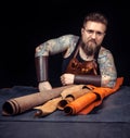 Currier producing leather goods in his workshop