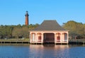 The Currituck Beach Lighthouse and pink boathouse near Corolla, North Carolina Royalty Free Stock Photo
