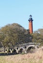 The Currituck Beach Lighthouse and wooden bridge near Corolla, North Carolina vertical Royalty Free Stock Photo