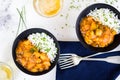 Curry chicken on black bowls and beer