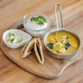 Curry Dish with Paratha serve on wooden tray