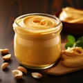 Curry Peanut Butter Spread In Jar On Wooden Table - Stock Image