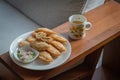 Curry puff in white dish and Tea cup on wood Royalty Free Stock Photo