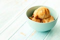 Curry puff pastry in cyan vintage bowl put on old table with copy-space