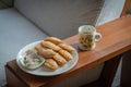 Curry puff in white dish and Tea cup on wood Royalty Free Stock Photo