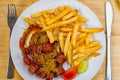 Curry sausage with French fries Royalty Free Stock Photo