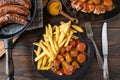 Curry sausage with curry sauce and french fries. Traditional german fast food meal Royalty Free Stock Photo