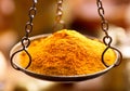 Curry spice powder in bowl weights