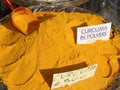 Curry turmeric powder with writing in Italian Curcuma in POLVERE Royalty Free Stock Photo