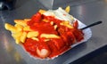 Currywurst is a fast food dish of German origin consisting of steamed, then fried pork sausage Royalty Free Stock Photo