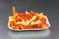 Currywurst with french fries and ketchup from Curry 36. Curry 36 is famous curry sausage restaurant in Berlin. Royalty Free Stock Photo