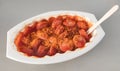 Currywurst - German fast food in plastic container with wooden fork