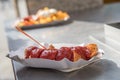 Currywurst a typical German street food grilled and sliced sausage with curry ketchup