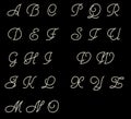 Cursive latin letters on black background