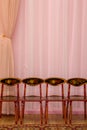 Curtain background with highchairs Royalty Free Stock Photo
