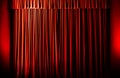 the curtain lights up with a red light as the show is about to begin Royalty Free Stock Photo