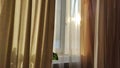 Curtain with tulle on the window. The interior of the room with draped curtains Royalty Free Stock Photo
