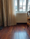 Curtains windows wood chair and wooden floor