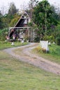 Curve dirt road to the countryside house Royalty Free Stock Photo