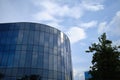 Curve glass building on the blue sky background. Royalty Free Stock Photo