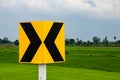 Curve marker traffic signs on grass field background Royalty Free Stock Photo