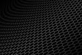 Curve metallic mesh on black background.