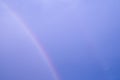 Curve multi color double rainbow on blue sky. abstract pastel light on hogh air on climate after rain fallen Royalty Free Stock Photo