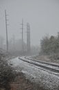 The curve of the railroad tracks on a snowy day Royalty Free Stock Photo