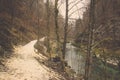 Curve right pathway and clear stream in forest