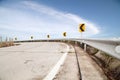 Curve road and sign on down hill , on blue sky and cloud backgr Royalty Free Stock Photo