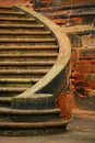 Curved staircase made of red stones Royalty Free Stock Photo