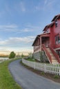 Curved asphalt pathway at the front of a fenced house at Daybreak, Utah