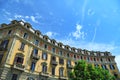 Curved baroque style residential building exterior view from below under blue sky Turin Italy