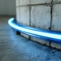 Curved blue neon light against a concrete wall. Royalty Free Stock Photo