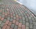 Curved cobble pavement with street