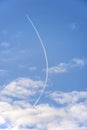 Curved contrail. Jet airliner plane flying at altitude leaving curving contrails Royalty Free Stock Photo