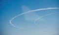 Curved Contrails in Blue Sky