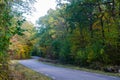 Curved country road in  fall season colors Royalty Free Stock Photo