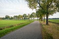 Curved country road in Dutch rural landscape