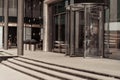 Curved doorway to the office, bank, corporation. Glass and metal doors.