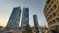 Curved facade of the Hayat Hotel at twilight, in Riyadh, the Kingdom Tower in perspective view at bottom right corner