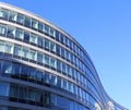 Curved facde of modern building sunny day blue sky Royalty Free Stock Photo