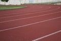 Curved foreground on athletic track, unfocused background
